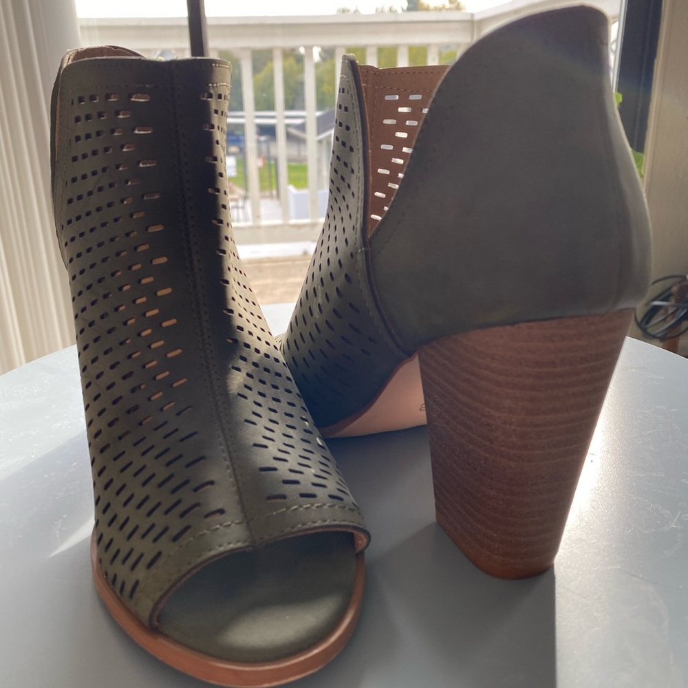 Heeled booties olive green eyelit cutouts